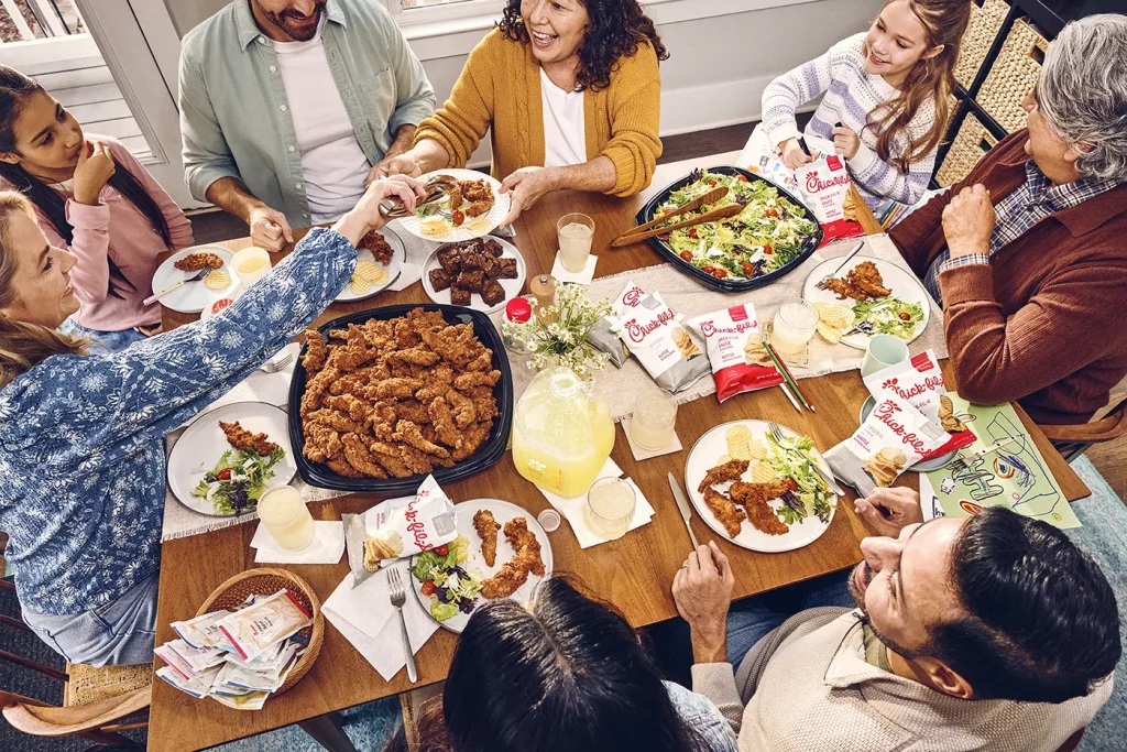 Justin Walker Chick-Fil-A dining room with family and friends